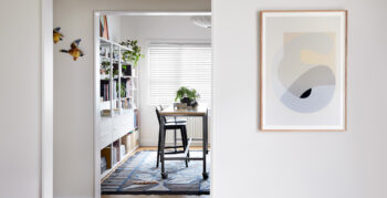 Maike Design bookshelves and workbench with artwork