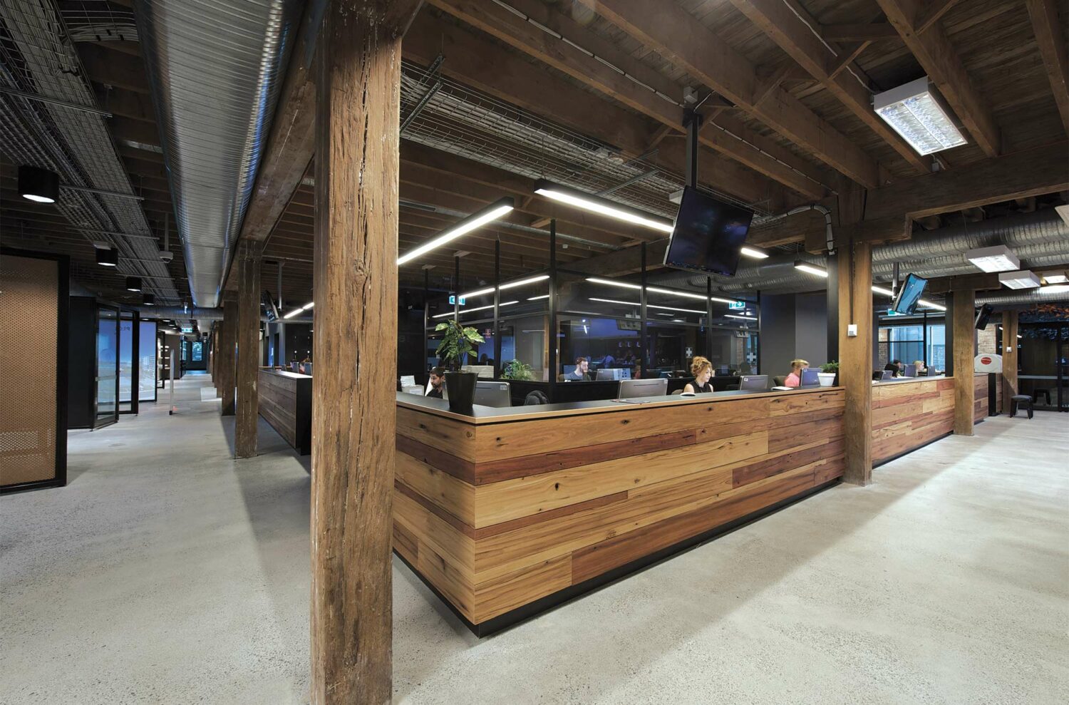 Maike Design Creative design school, warehouse conversion. Timber reception desk and original timber framing