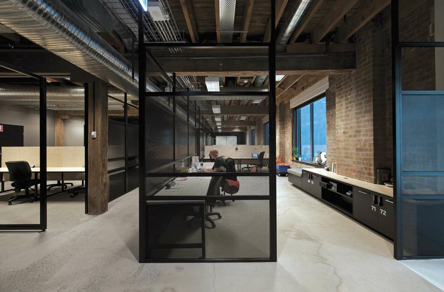 Maike Design Creative design school, warehouse conversion. Black framing and screens