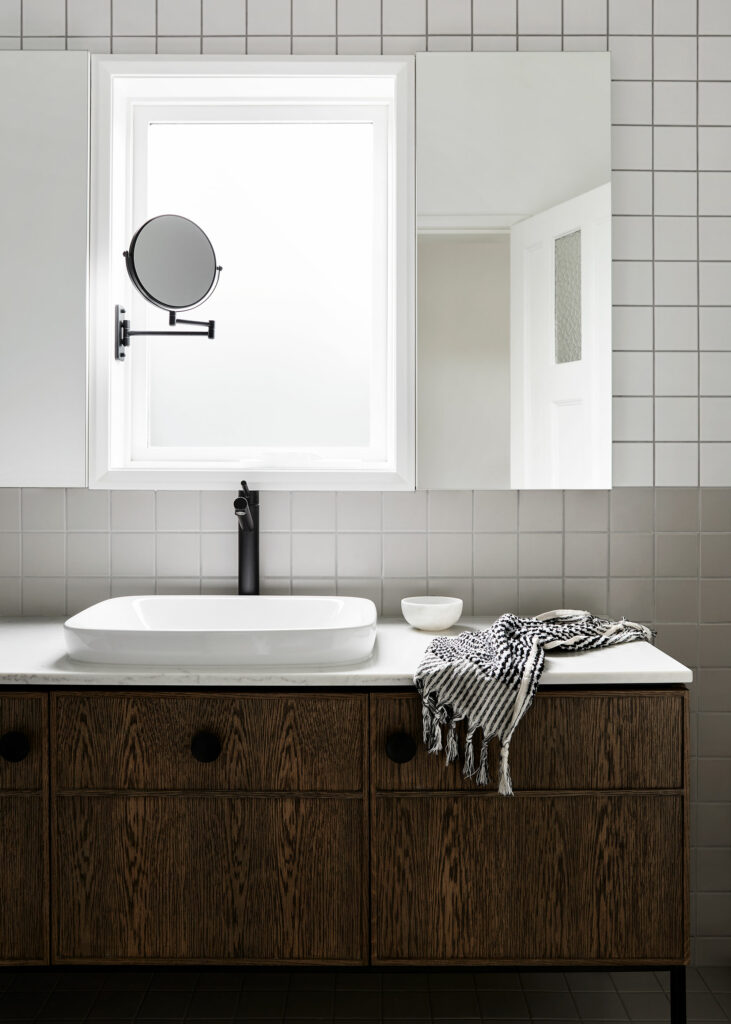 Maike Design two tone bathroom. Timber vanity and black tapware