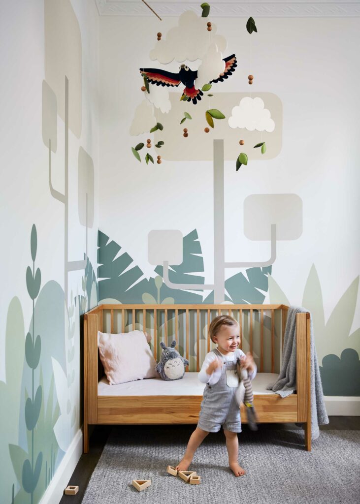 Maike Design nursery with hand made mobile and hand painted mural