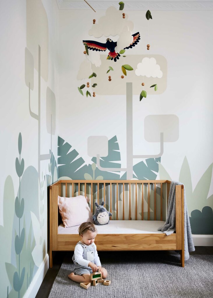 Maike Design nursery with hand made mobile and hand painted mural